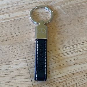 Mercedes black leather key fob with white stitching. Brand new.